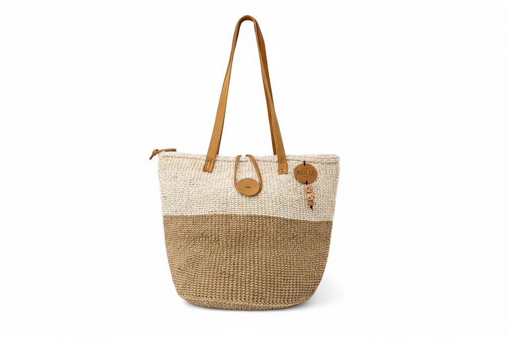 Handwoven two-tone sisal tote bag with leather handles handmade by women artisans in Kenya by Asiliz.