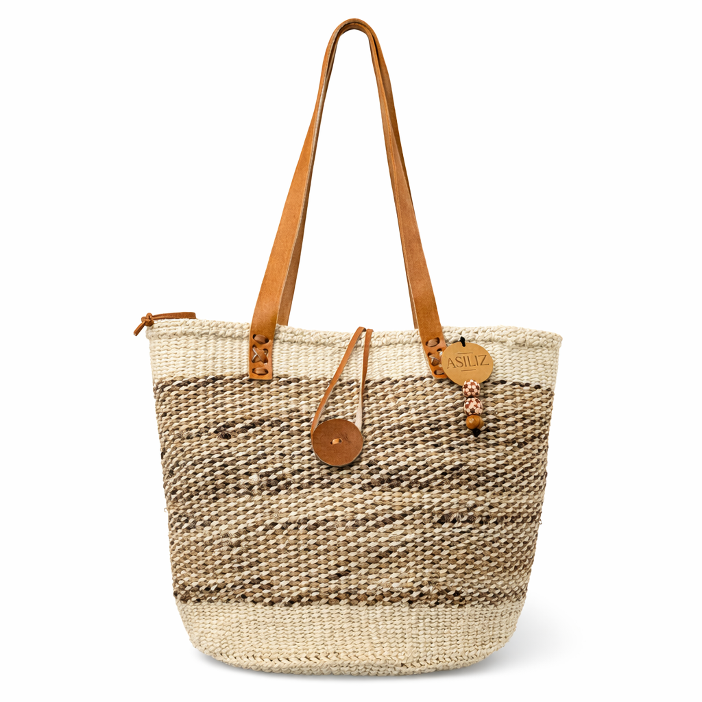 Handwoven natural and white sisal tote bag with leather handles handmade by women artisans in Kenya by Asiliz.